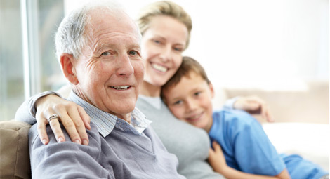 Old man sat with his daughter and grandson