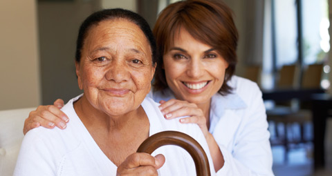 older woman with a carer